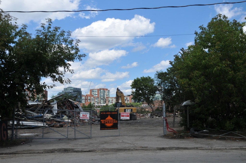 Image: Construction fence and demolition debris, photo taken August 3 2015